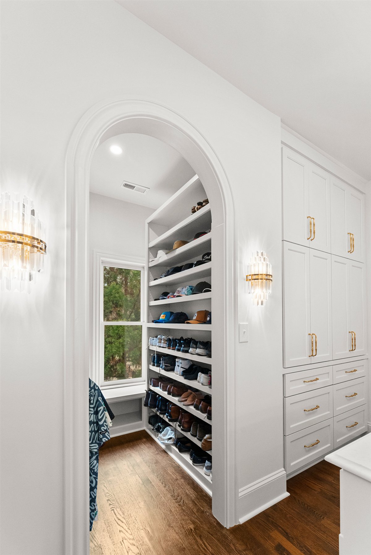 Arched closet doorway with shelving, The Point renovation