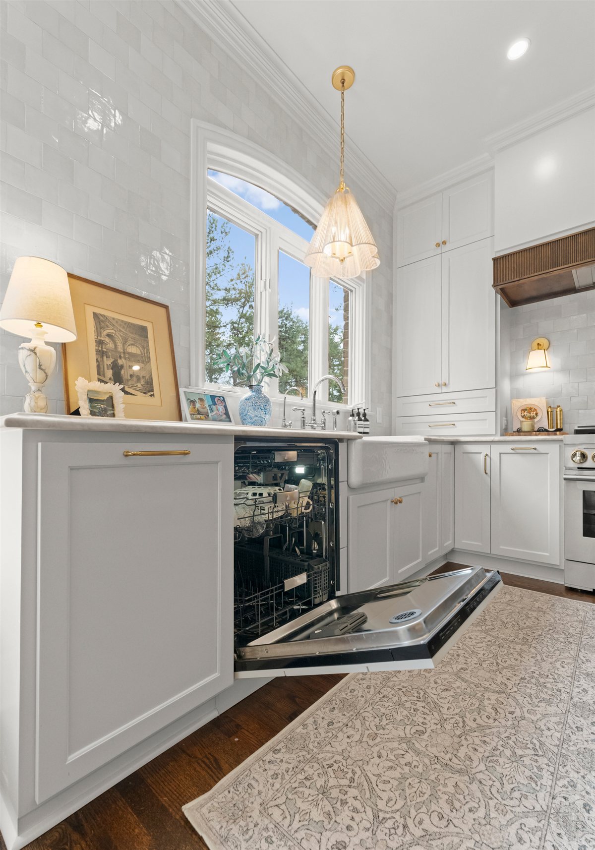 White cabinetry with a beverage fridge and window, The Point kitchen