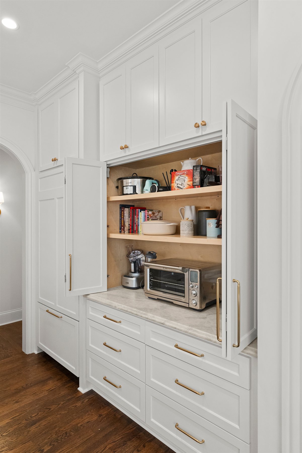 Appliance garage with open shelves in white cabinetry, The Point kitchen