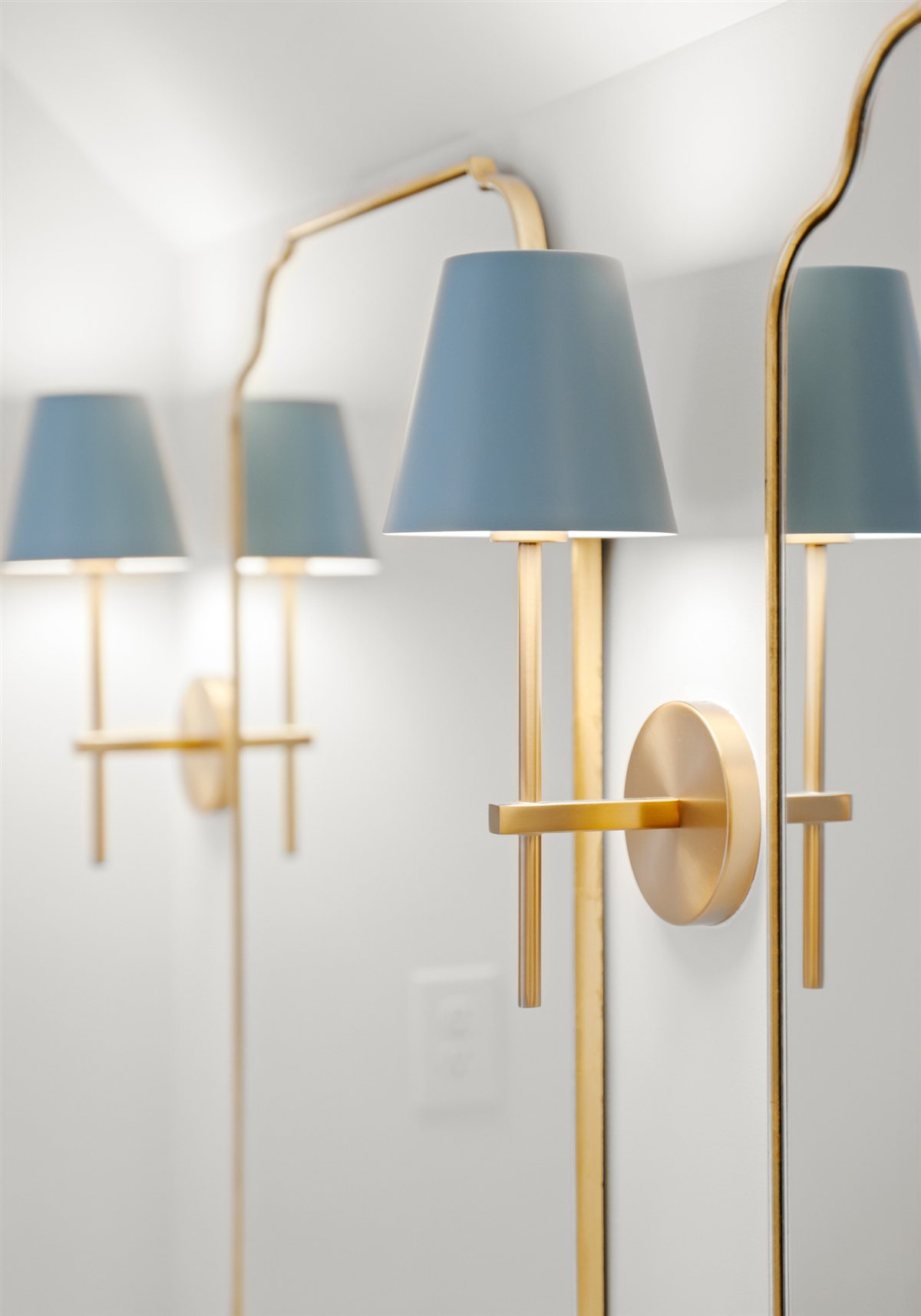 Brass sconces with blue shades, The Point renovation