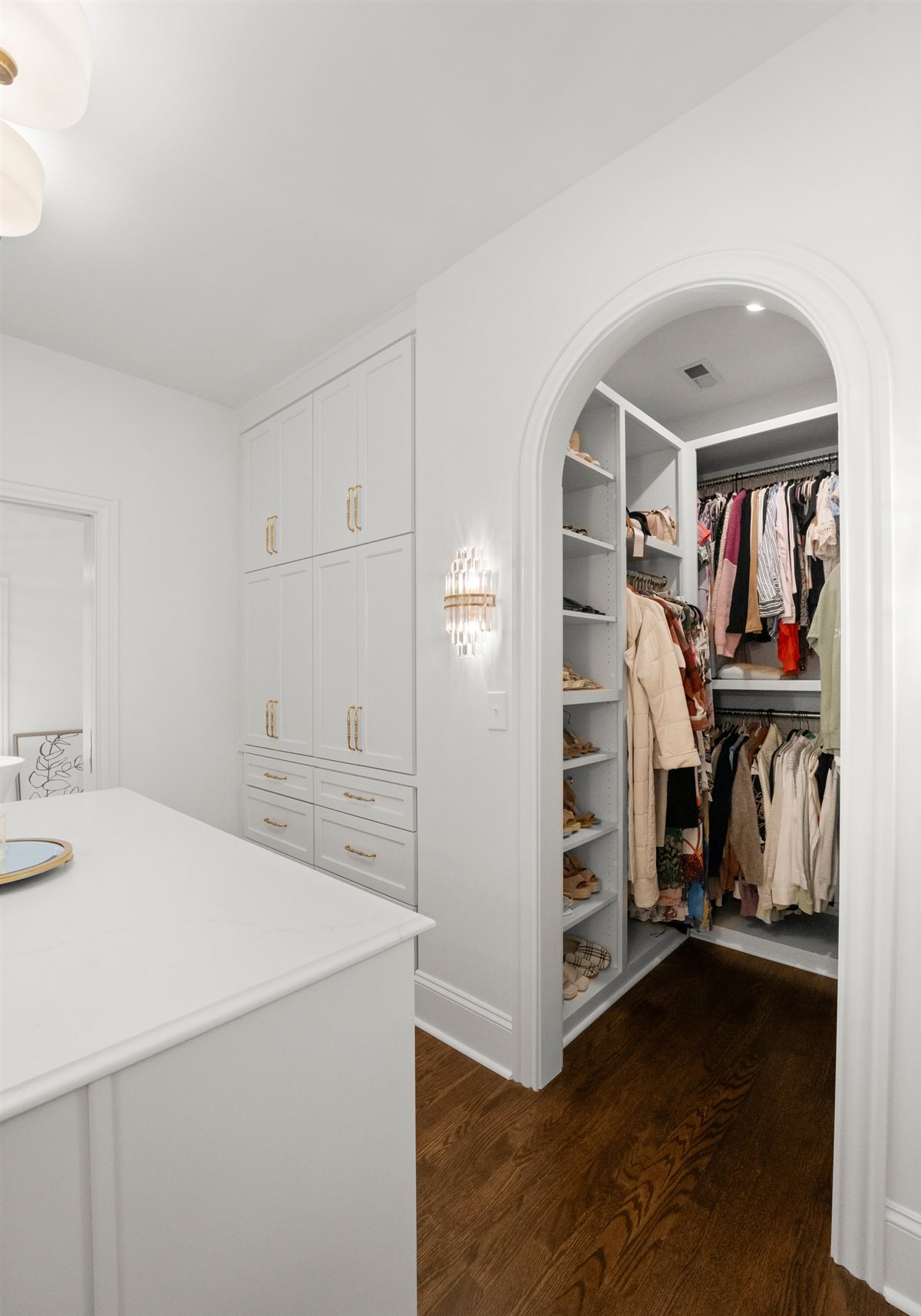 Arched closet entry and white built-ins, The Point renovation