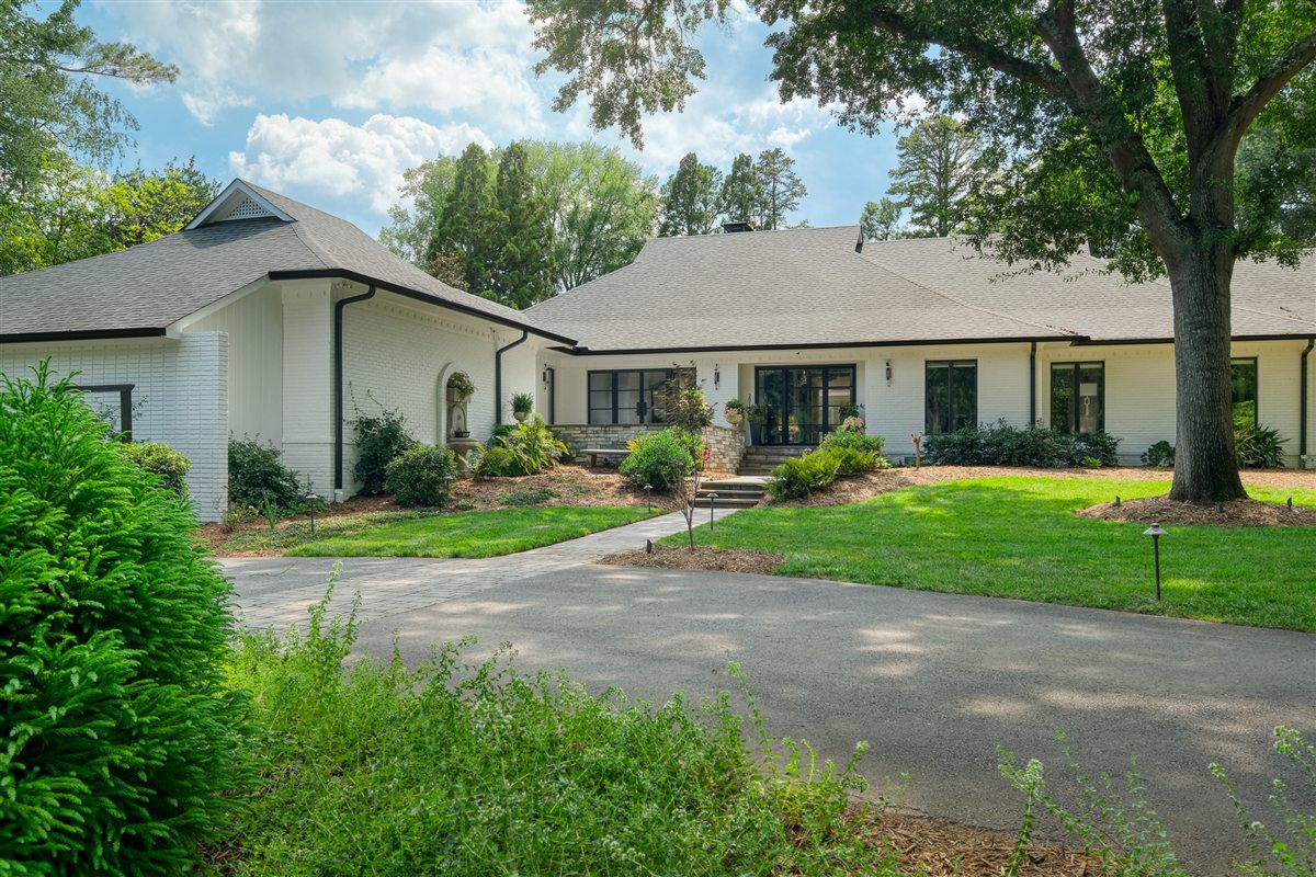Front of the renovated white-brick ranch and driveway, Pellyn Wood renovation