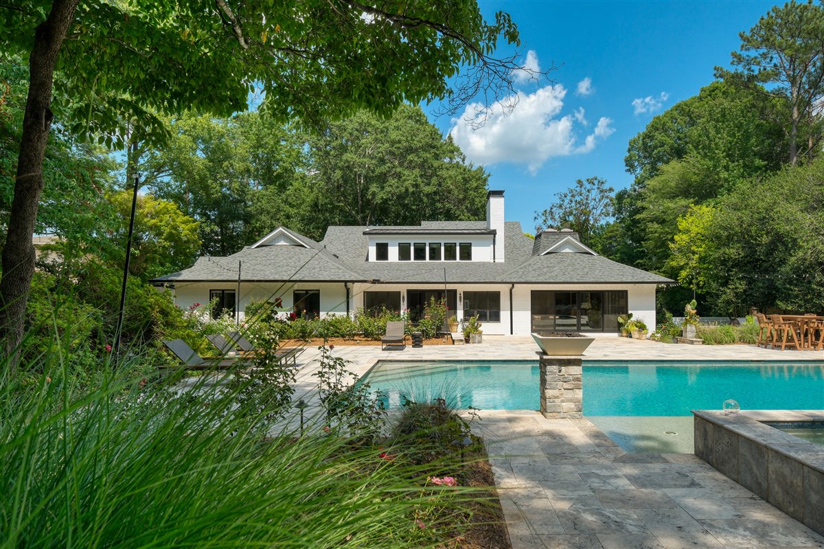 Pool and backyard of the white-brick ranch, Pellyn Wood renovation