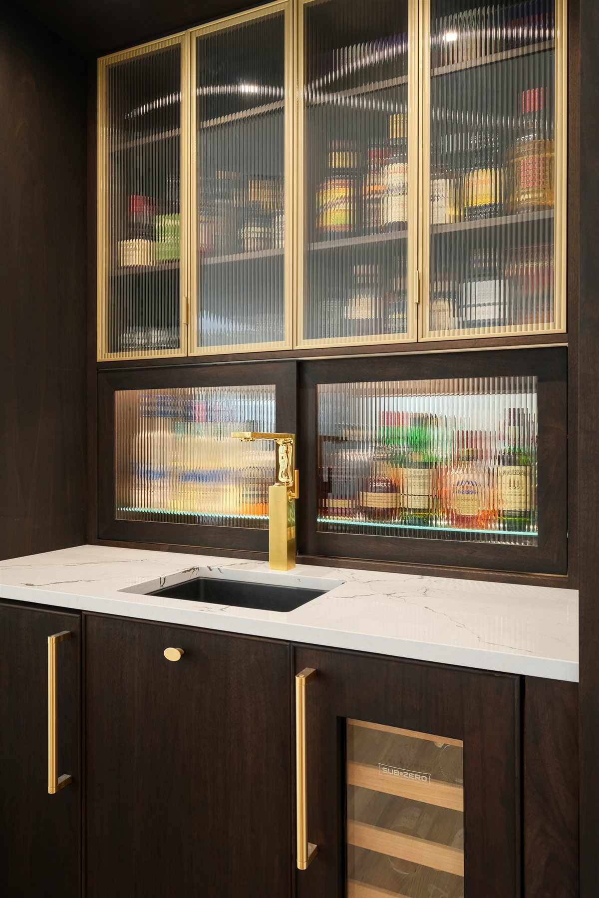 Bar with glass-front cabinets and a black sink, Pellyn Wood renovation