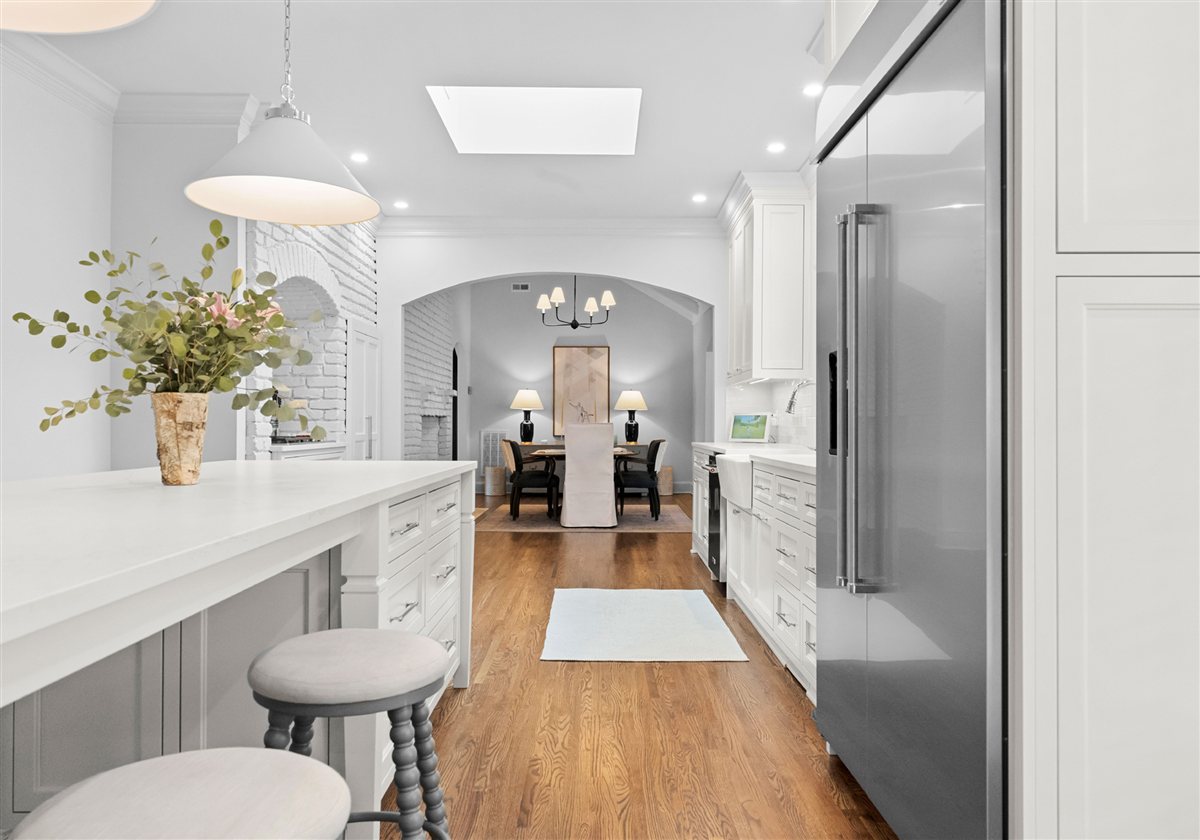Island with a flower arrangement and pendant lights, Providence Park historic home