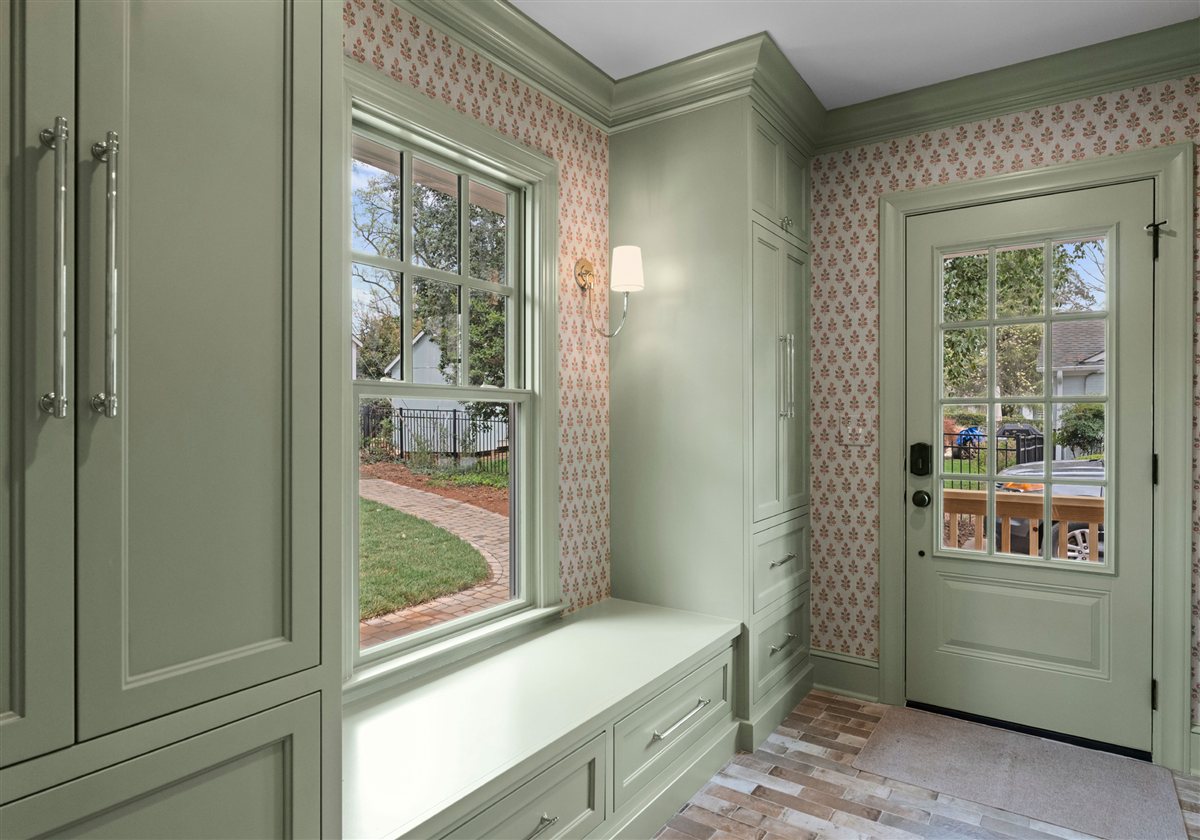 Mudroom with sage green built-ins and a window bench, Providence Park addition