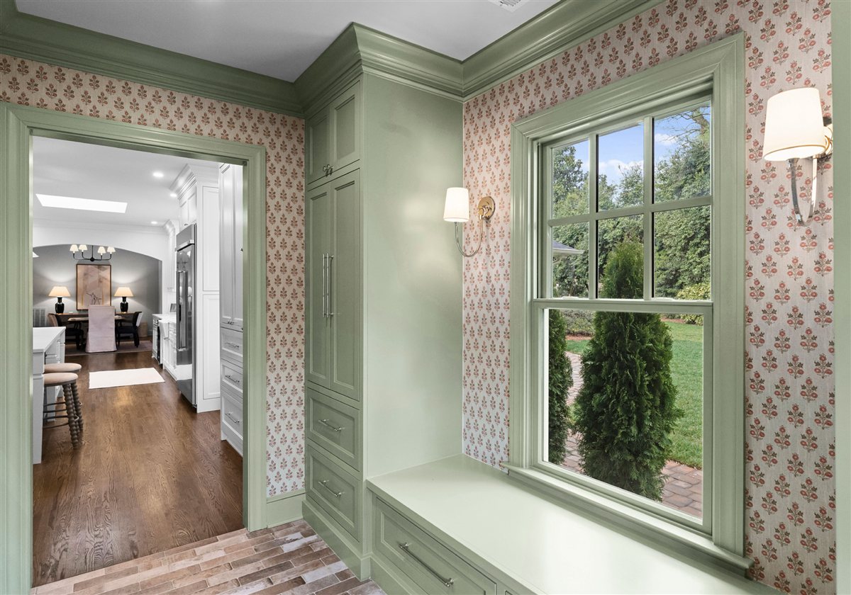 Sage green mudroom with patterned wallpaper, Providence Park addition