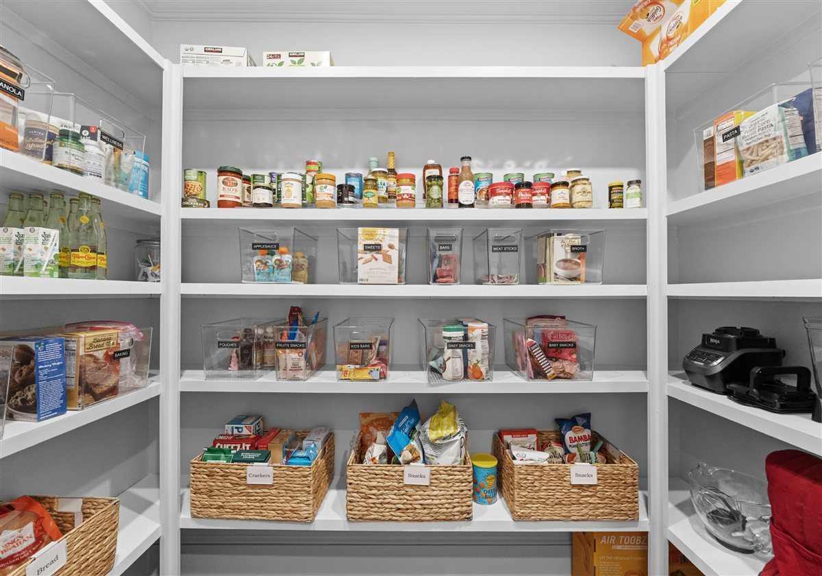 Walk-in pantry with white shelving and baskets, Providence Park addition