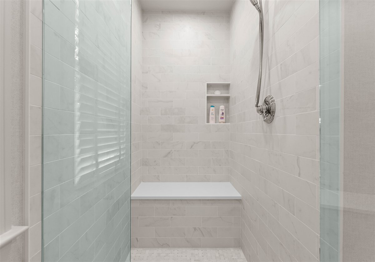 Shower with white tile and a glass panel, Providence Park historic home