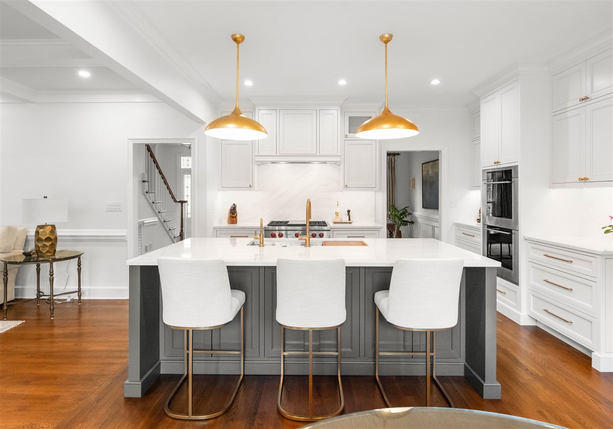 Island with white stools facing the range wall, Providence Plantation kitchen