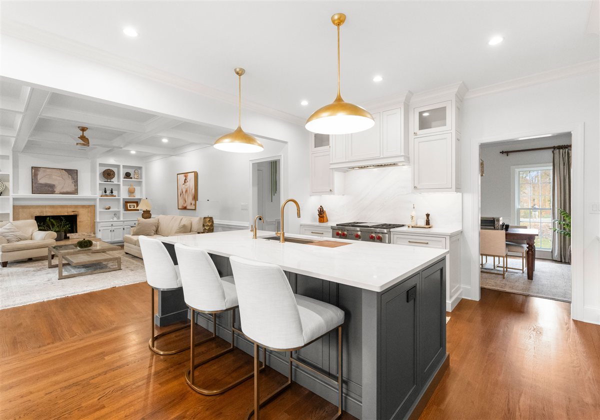 Kitchen open to the family room with a fireplace, Providence Plantation renovation