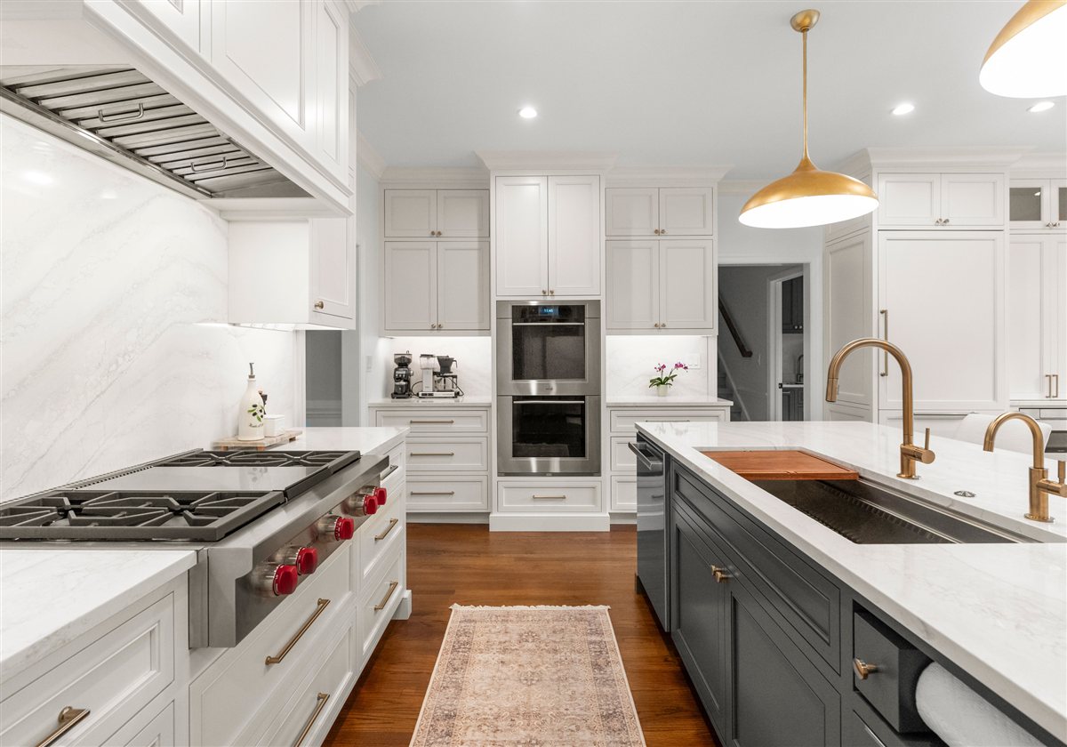Range and wall ovens with a stainless hood, Providence Plantation kitchen