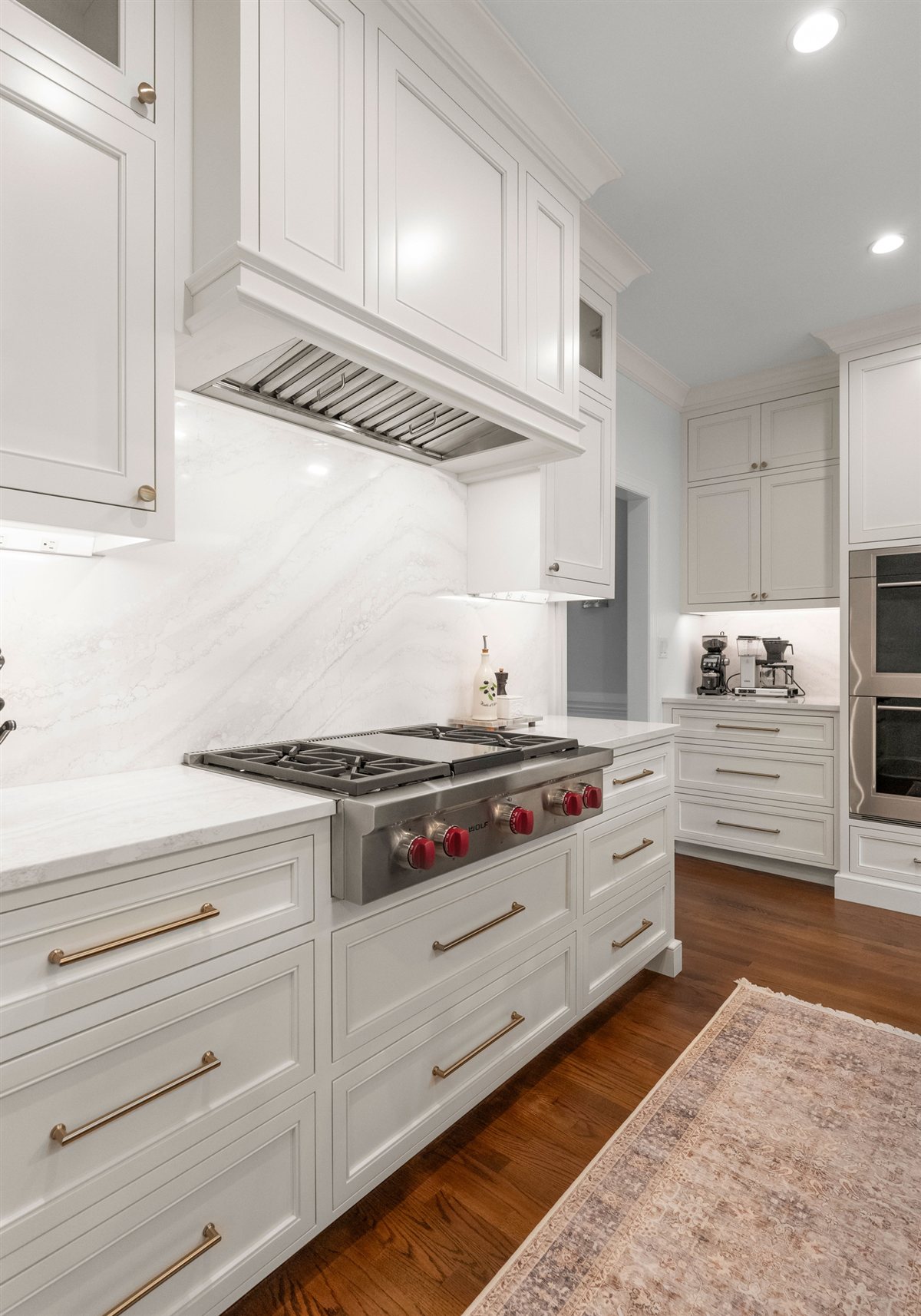 Range wall with white cabinetry and a stainless hood, Providence Plantation kitchen