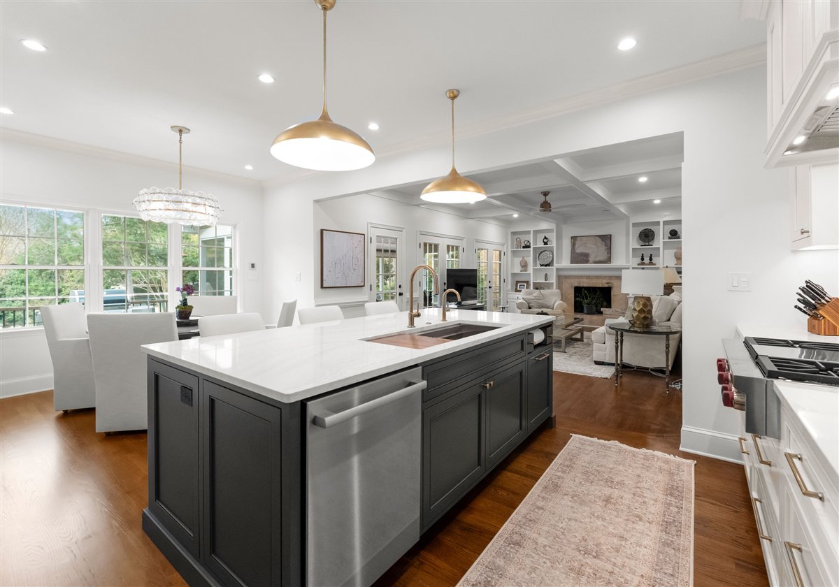 Charcoal island and white cabinetry toward the windows, Providence Plantation kitchen
