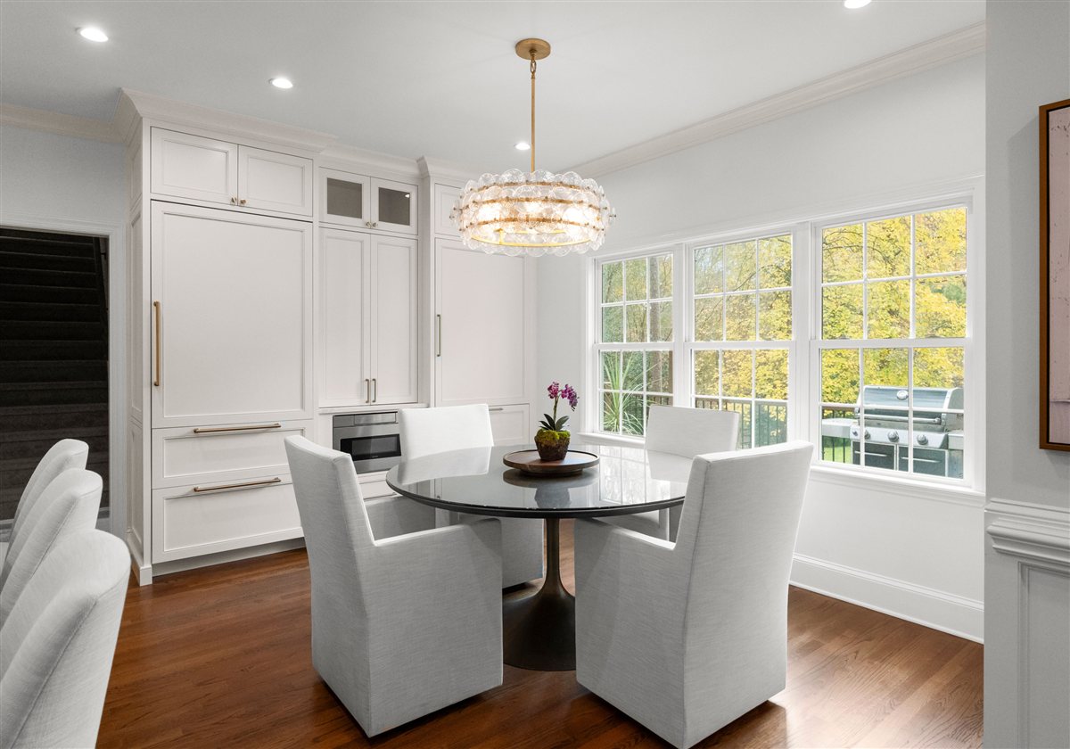 Breakfast nook with upholstered chairs by a bank of windows, Providence Plantation kitchen
