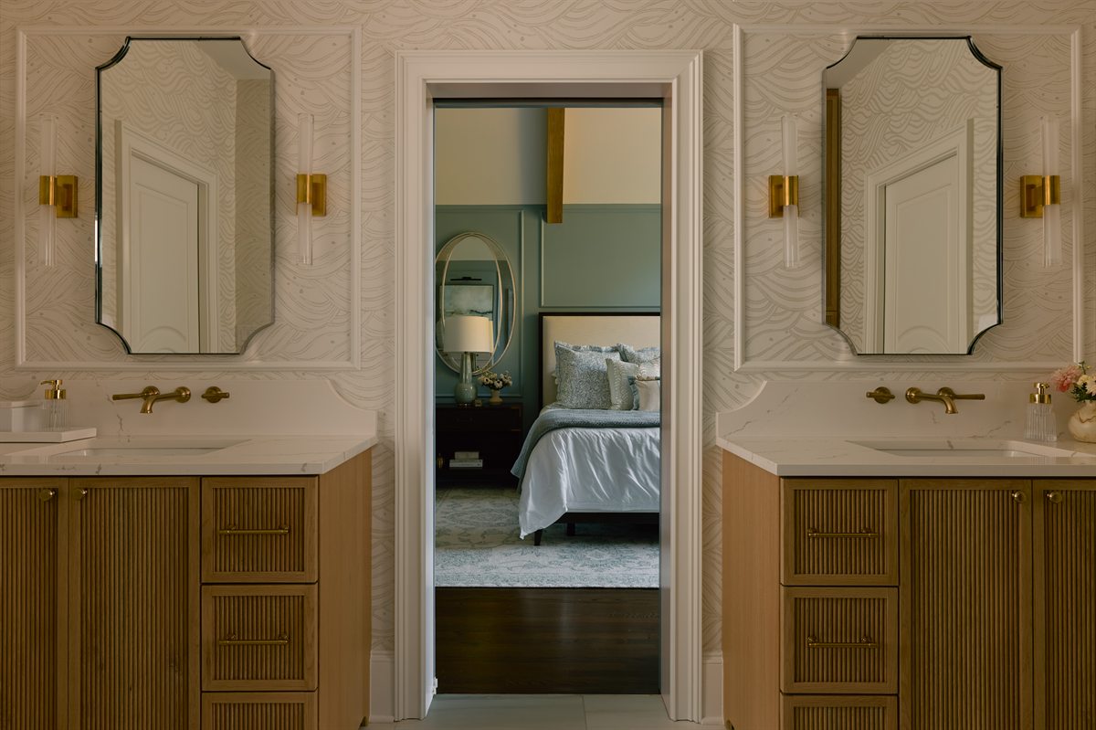 Primary bath with two custom fluted wood vanities and brass wall-mount faucets, Providence Springs, Charlotte