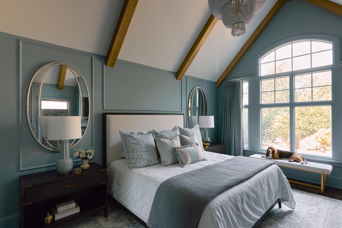 Vaulted primary bedroom with white oak clad beams, blue-gray panel molding and an arched window, Providence Springs