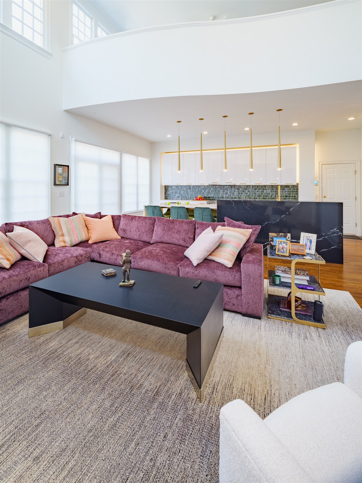 Living room with a black coffee table and sectional, SouthPark renovation