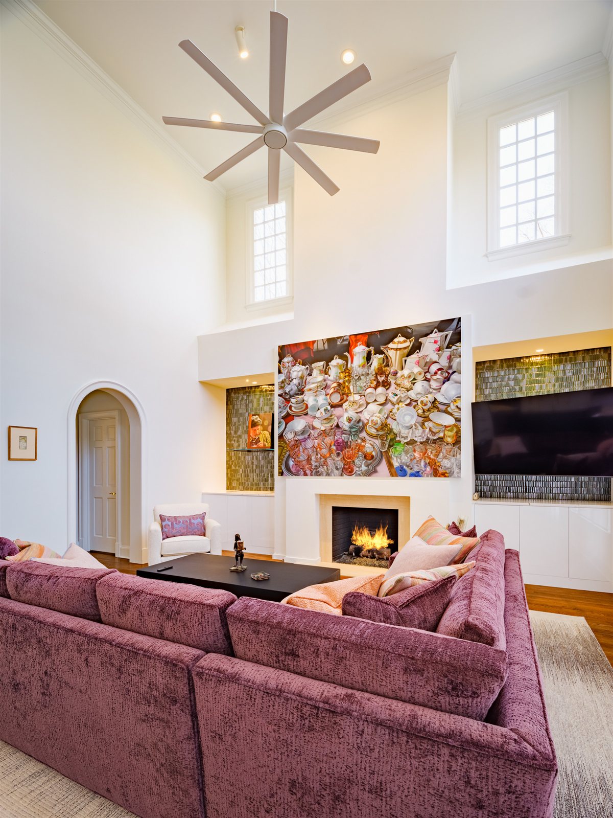 Living room with a fireplace and arched doorway, SouthPark renovation