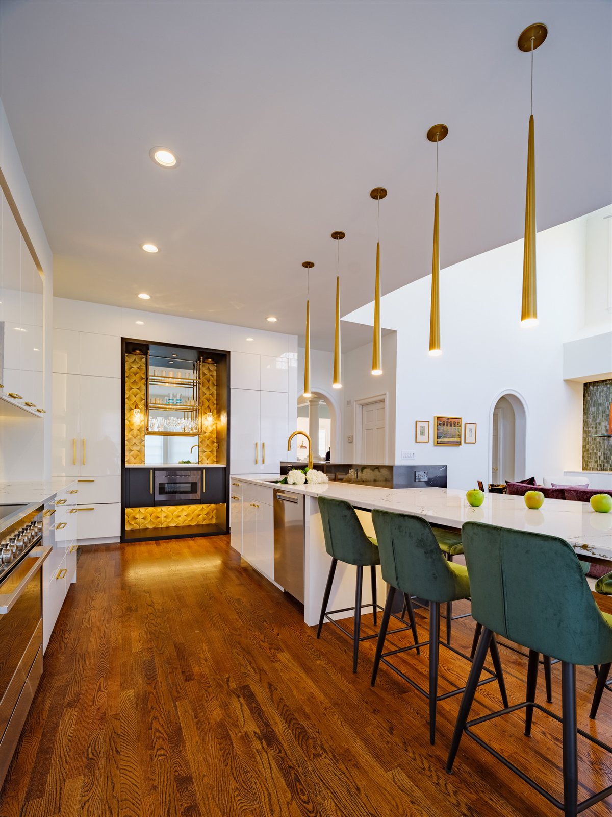 Kitchen with brass pendants and island seating, SouthPark kitchen