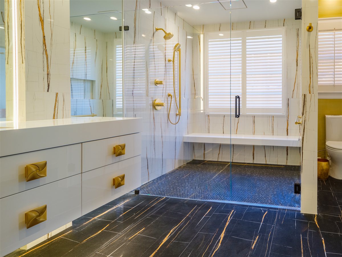 Bath with a glass shower and brass-trimmed vanity, SouthPark renovation