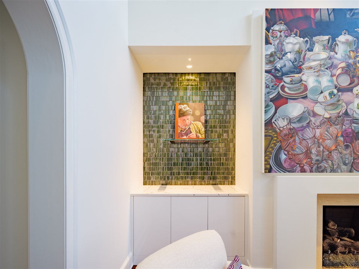 Arched hall with a green tile niche and artwork, SouthPark renovation