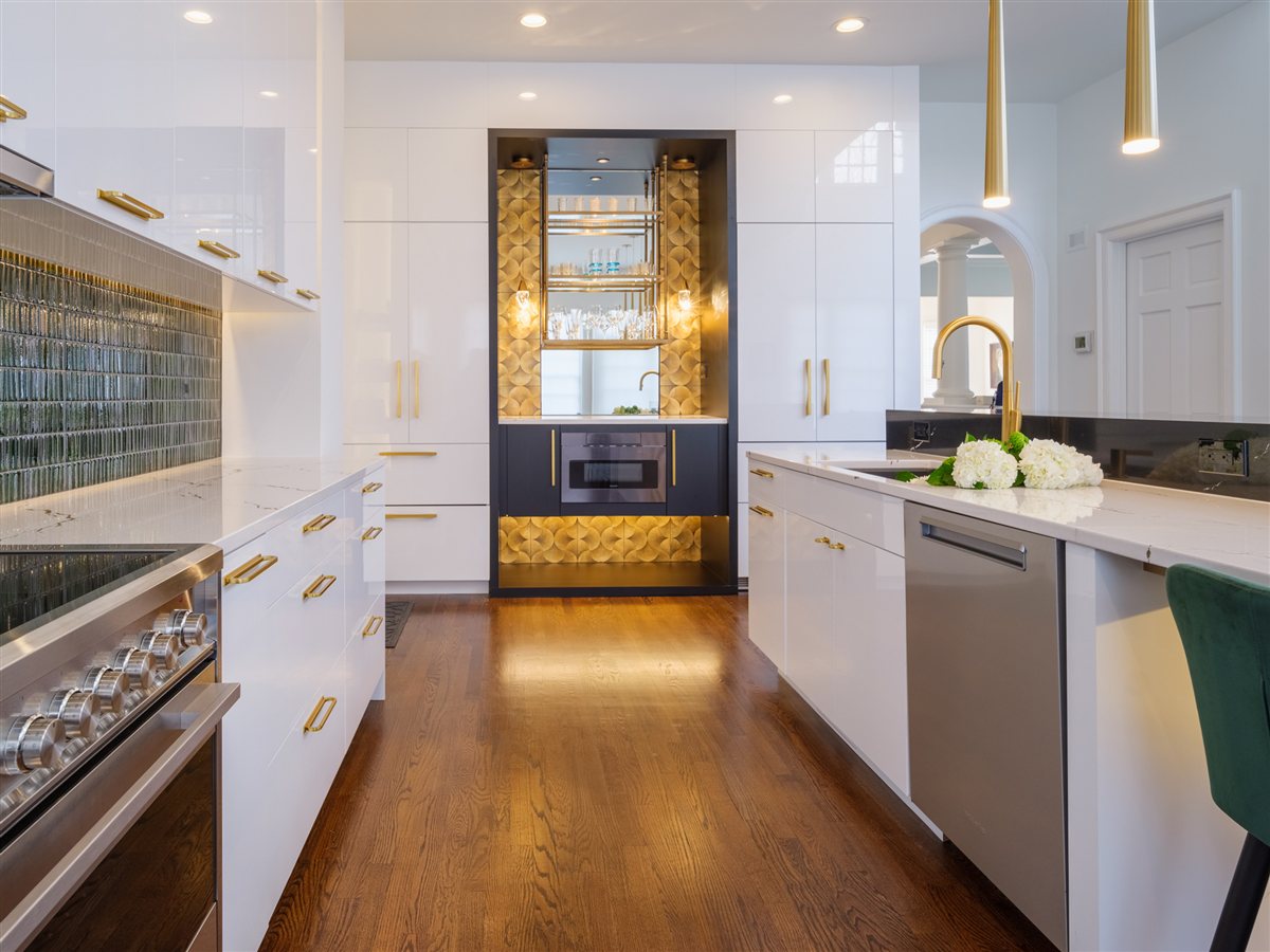 Kitchen with white cabinetry and a lit bar niche, SouthPark kitchen