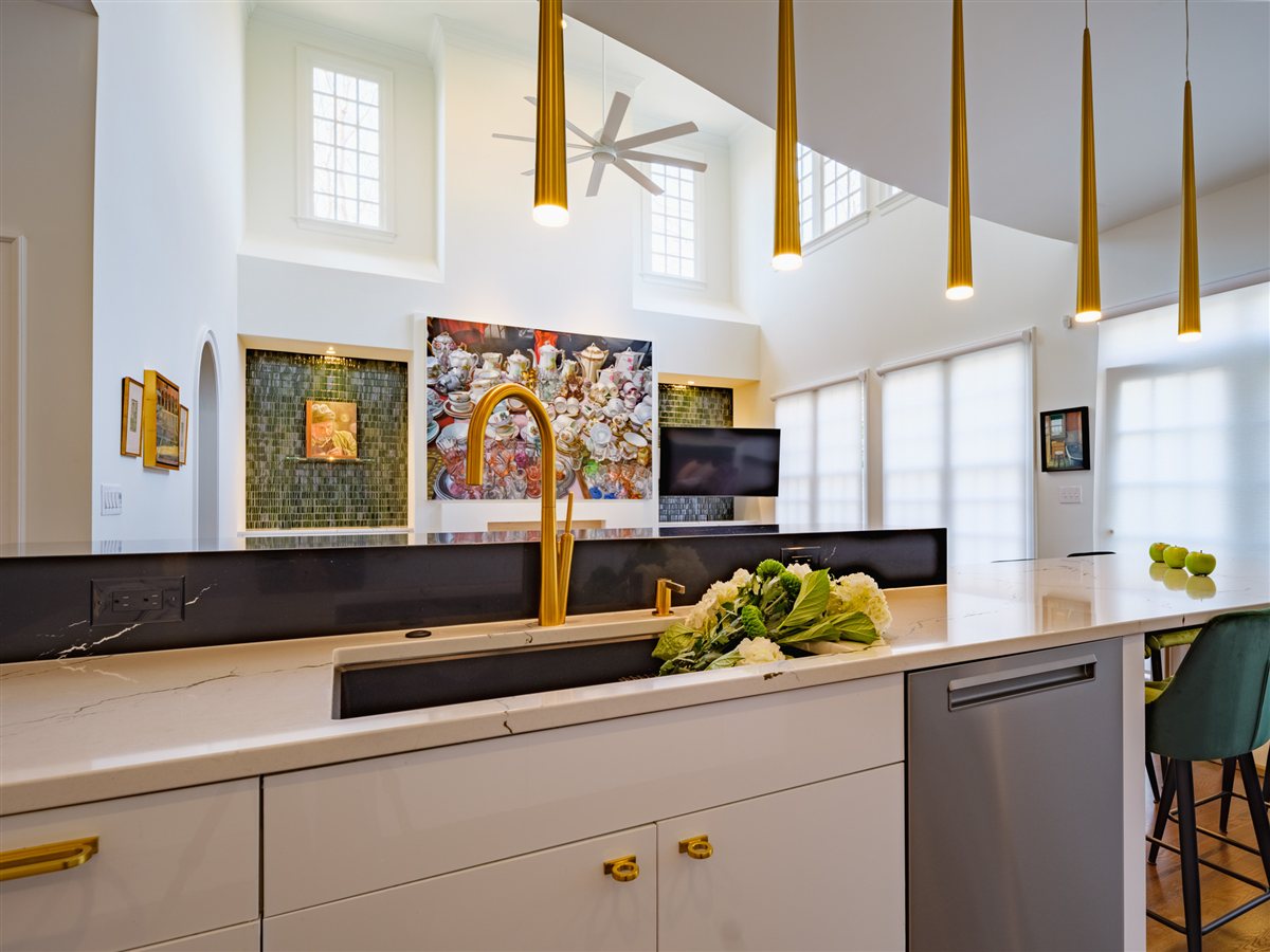 Sink run with a brass faucet and teal stools, SouthPark kitchen