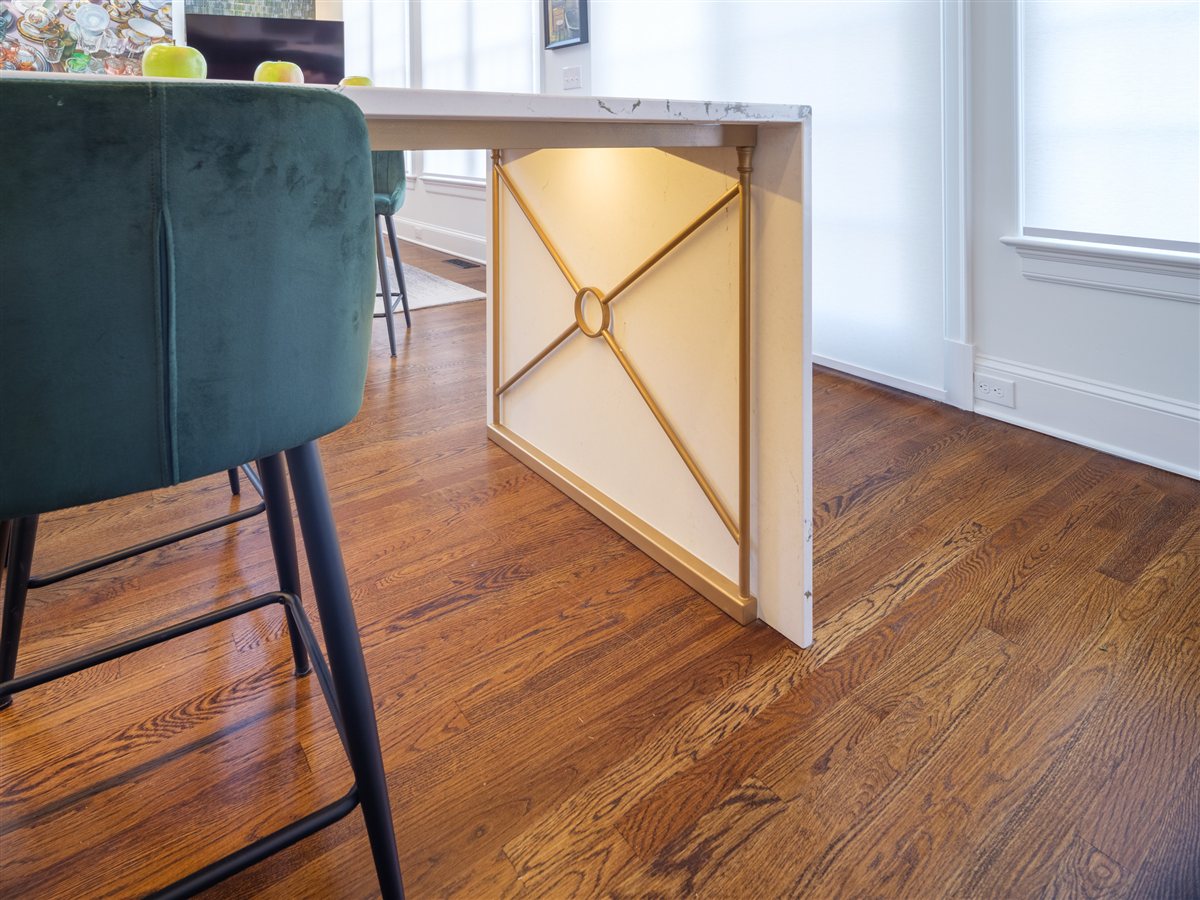 Waterfall island end with a brass inlay detail, SouthPark kitchen