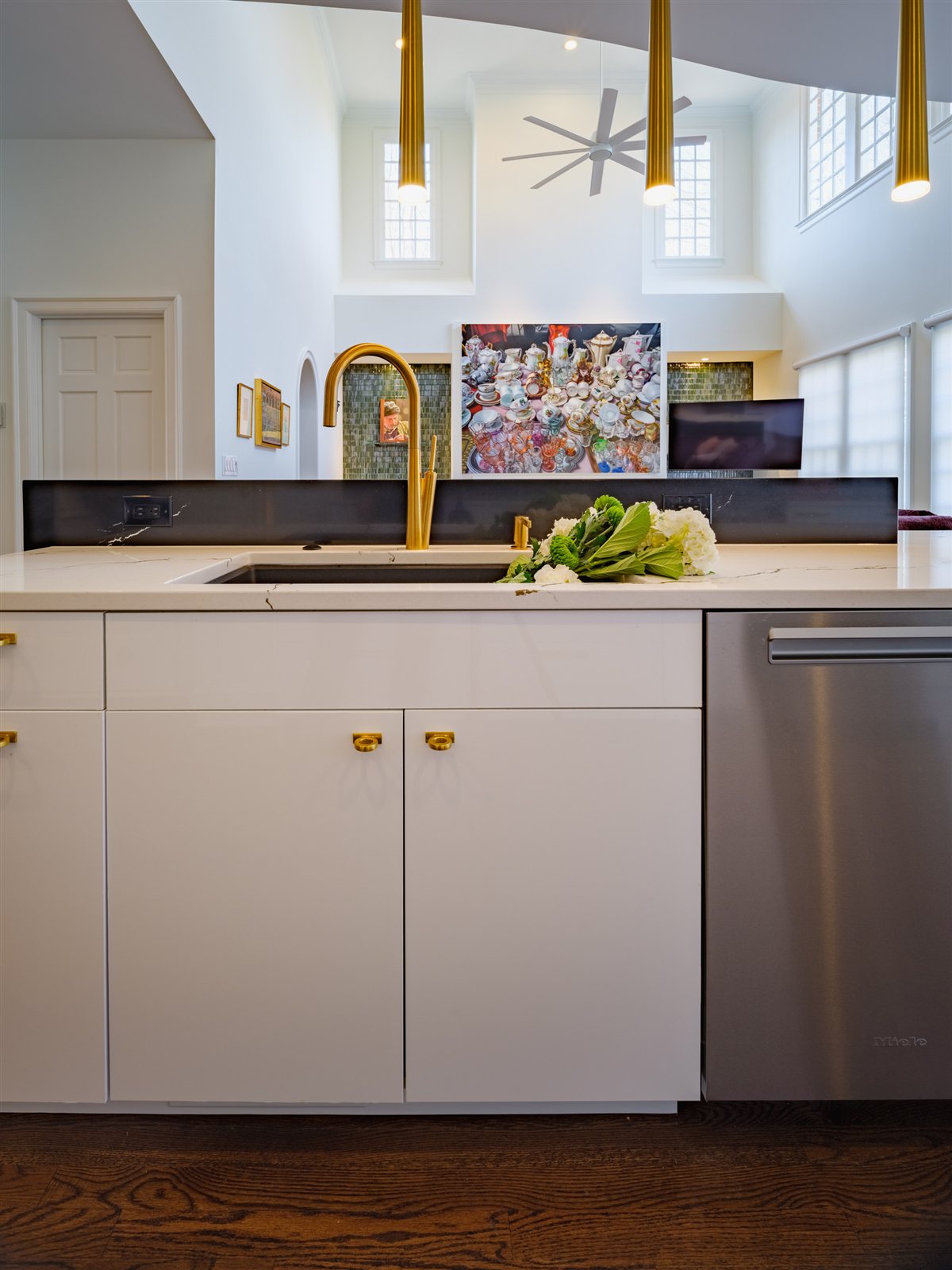 Bath vanity with a brass faucet and dark countertop, SouthPark renovation