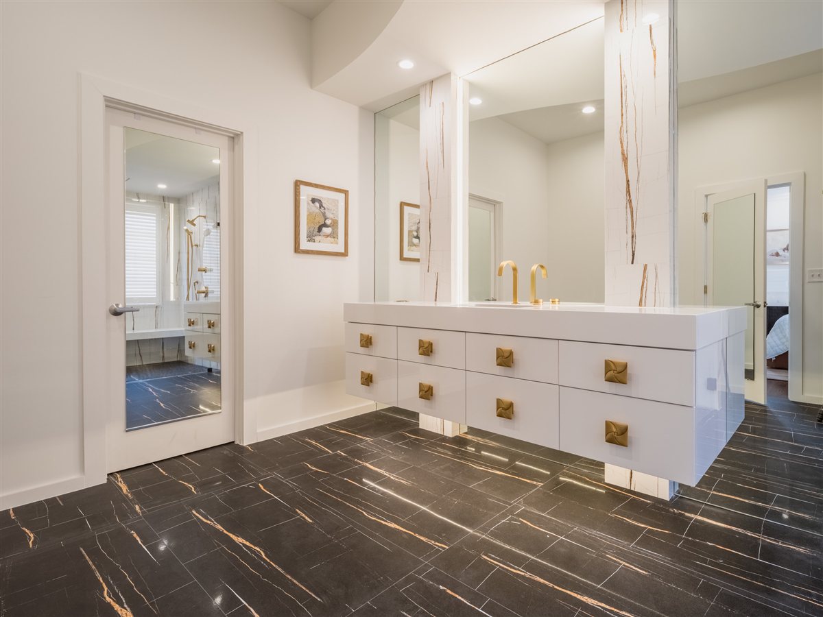 Primary bath vanity and veined floor, SouthPark renovation