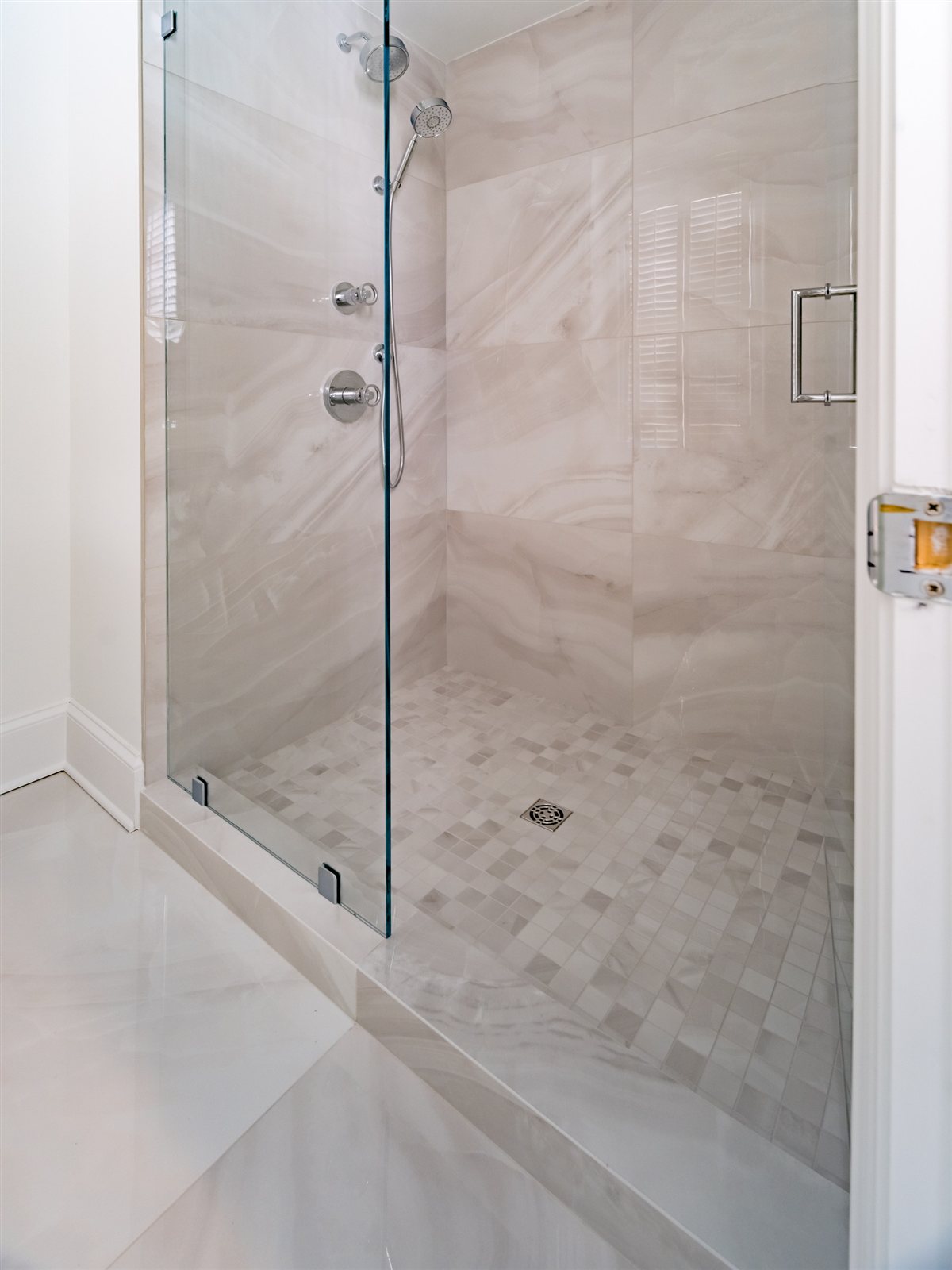Glass shower with stone-look walls, SouthPark renovation
