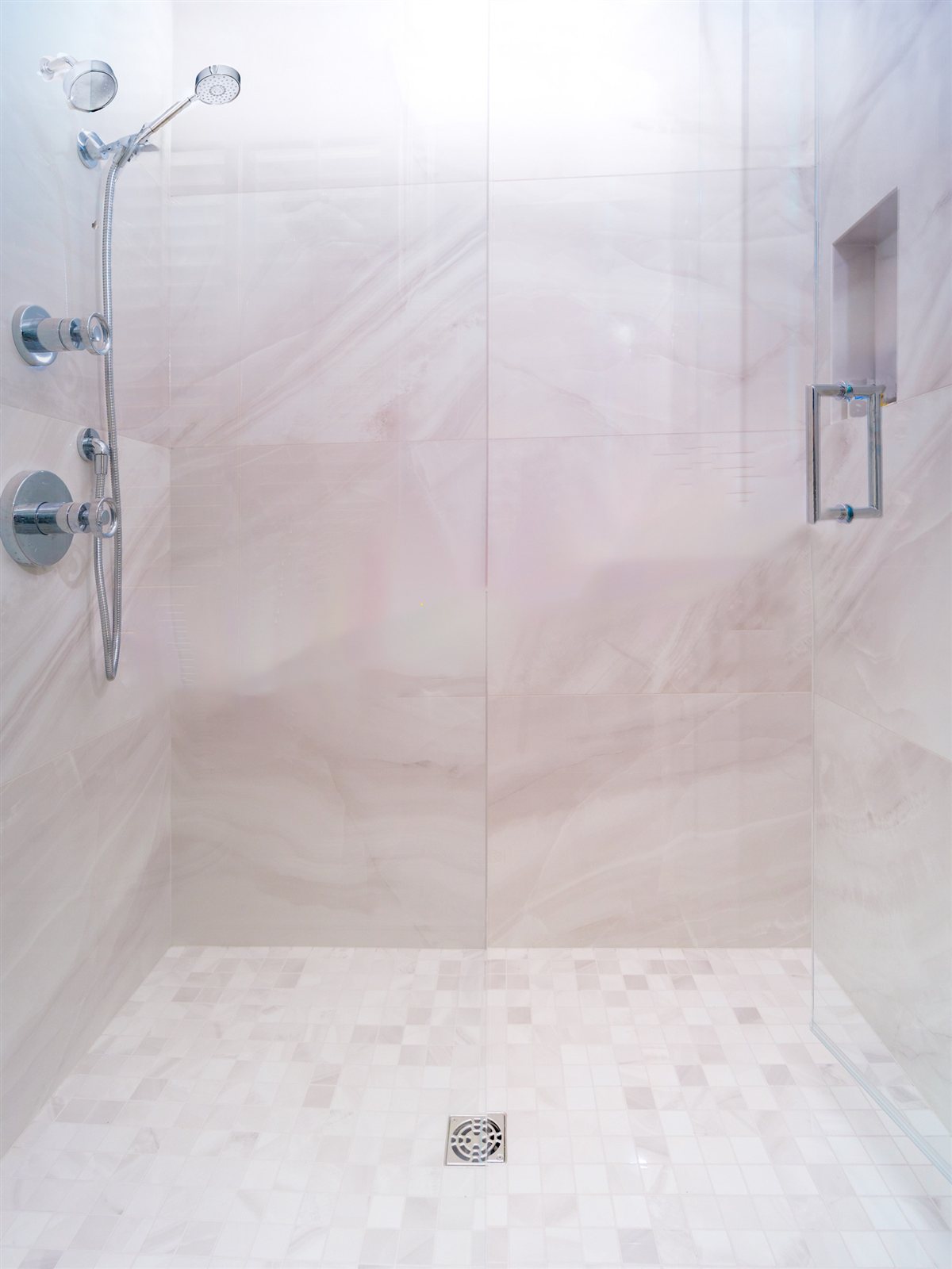 Walk-in shower with a hexagon tile floor, SouthPark renovation