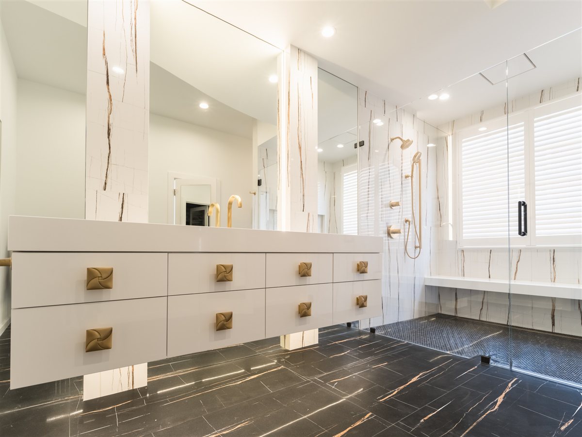 Double vanity beside a window seat, SouthPark renovation
