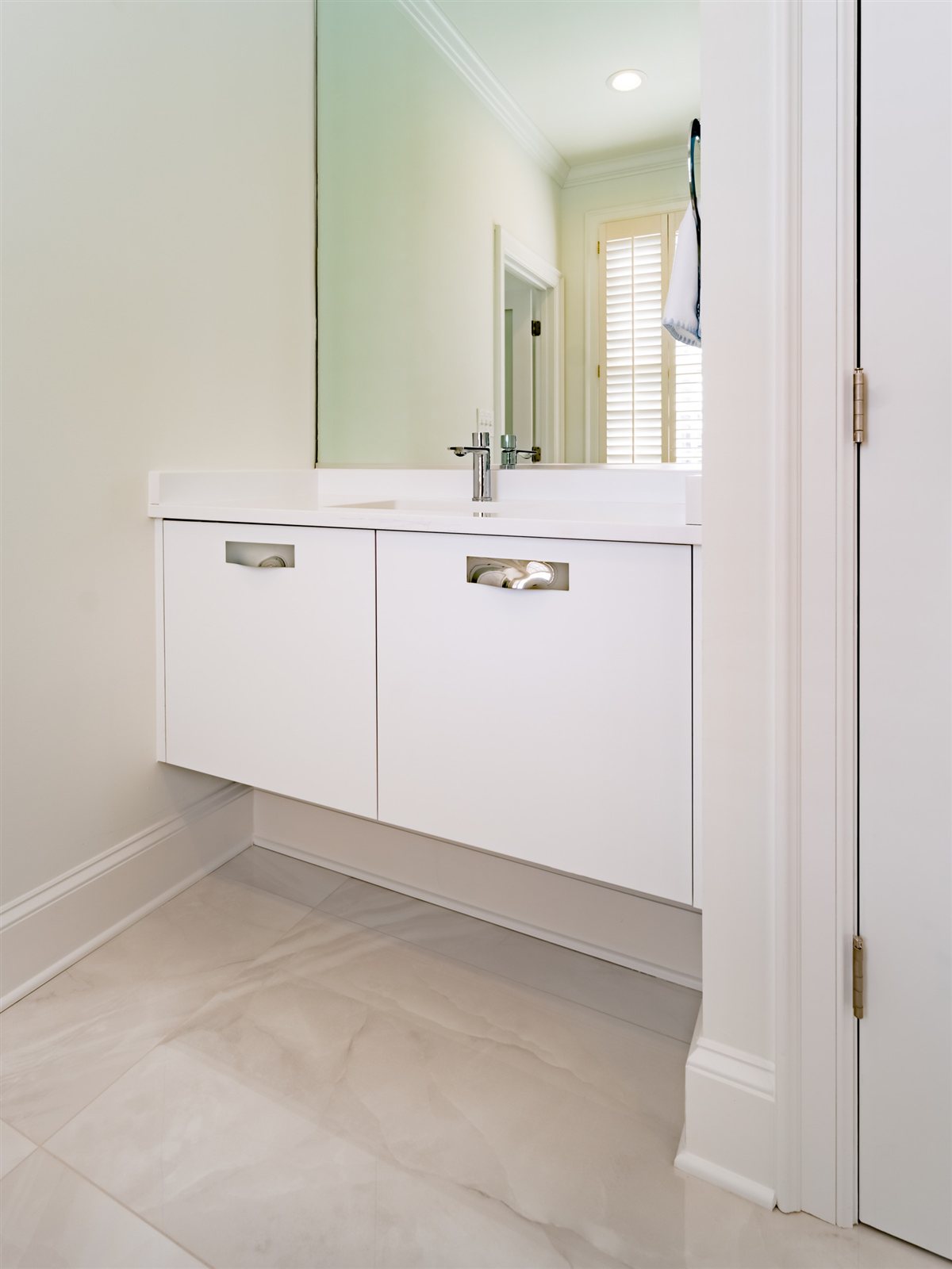 Guest bath with a floating white vanity, SouthPark renovation