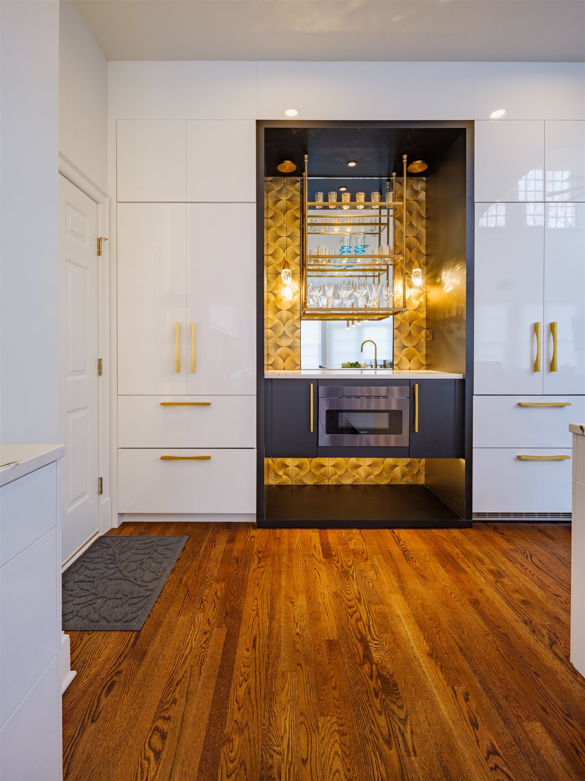 Lit bar niche with dark cabinetry, SouthPark kitchen