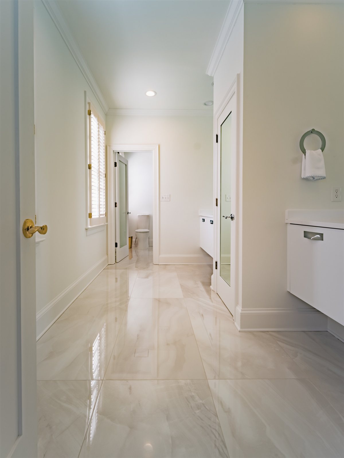 Bath hallway with a stone-look floor, SouthPark renovation
