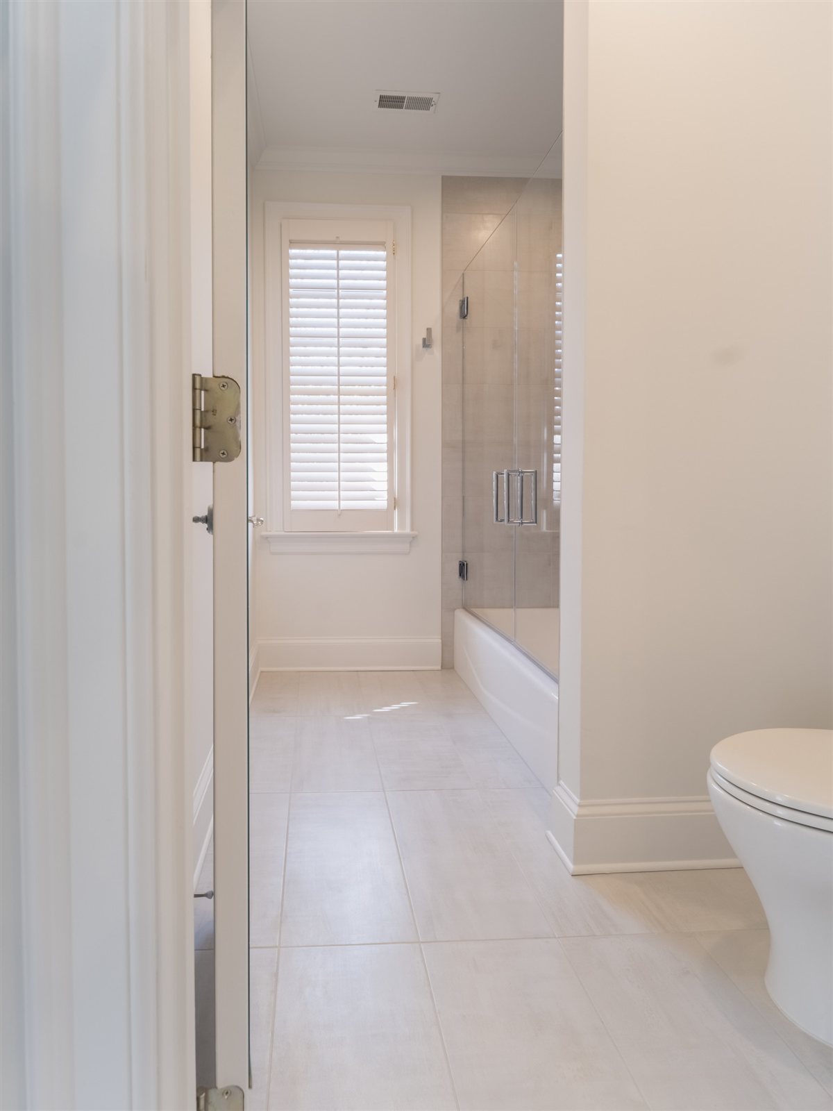 Bathroom with a glass shower door, SouthPark renovation
