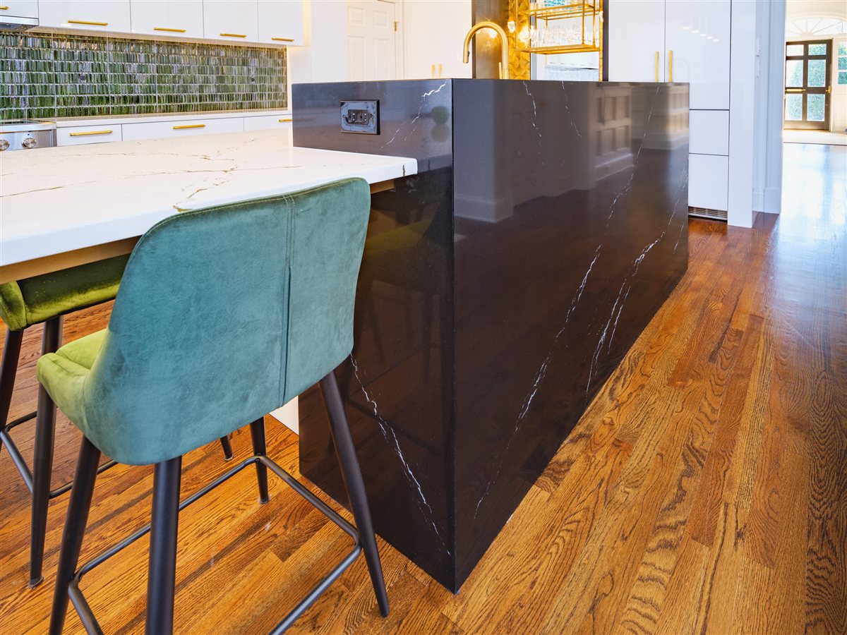 Custom black stone cube and a teal stool, SouthPark kitchen