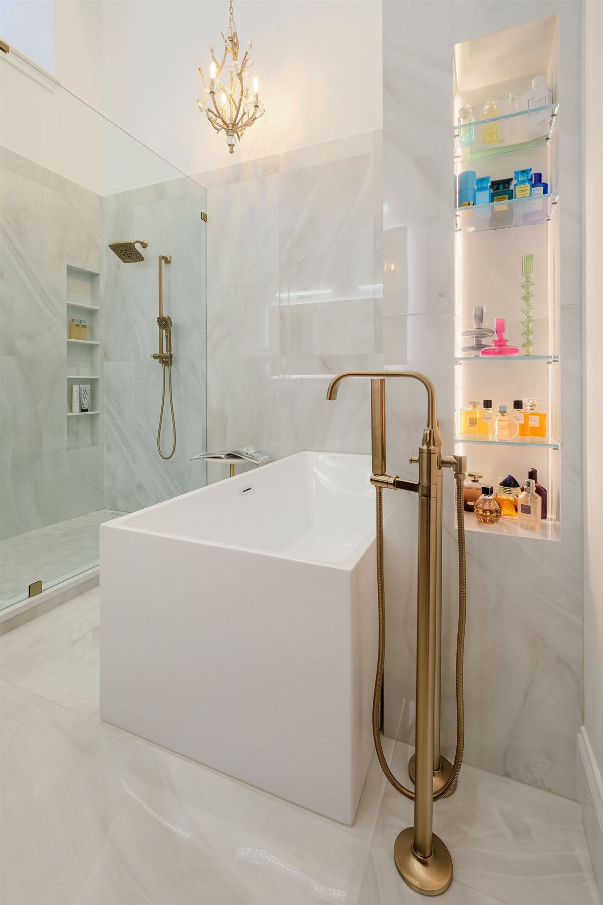 Freestanding tub beside a glass shower, Uptown primary suite