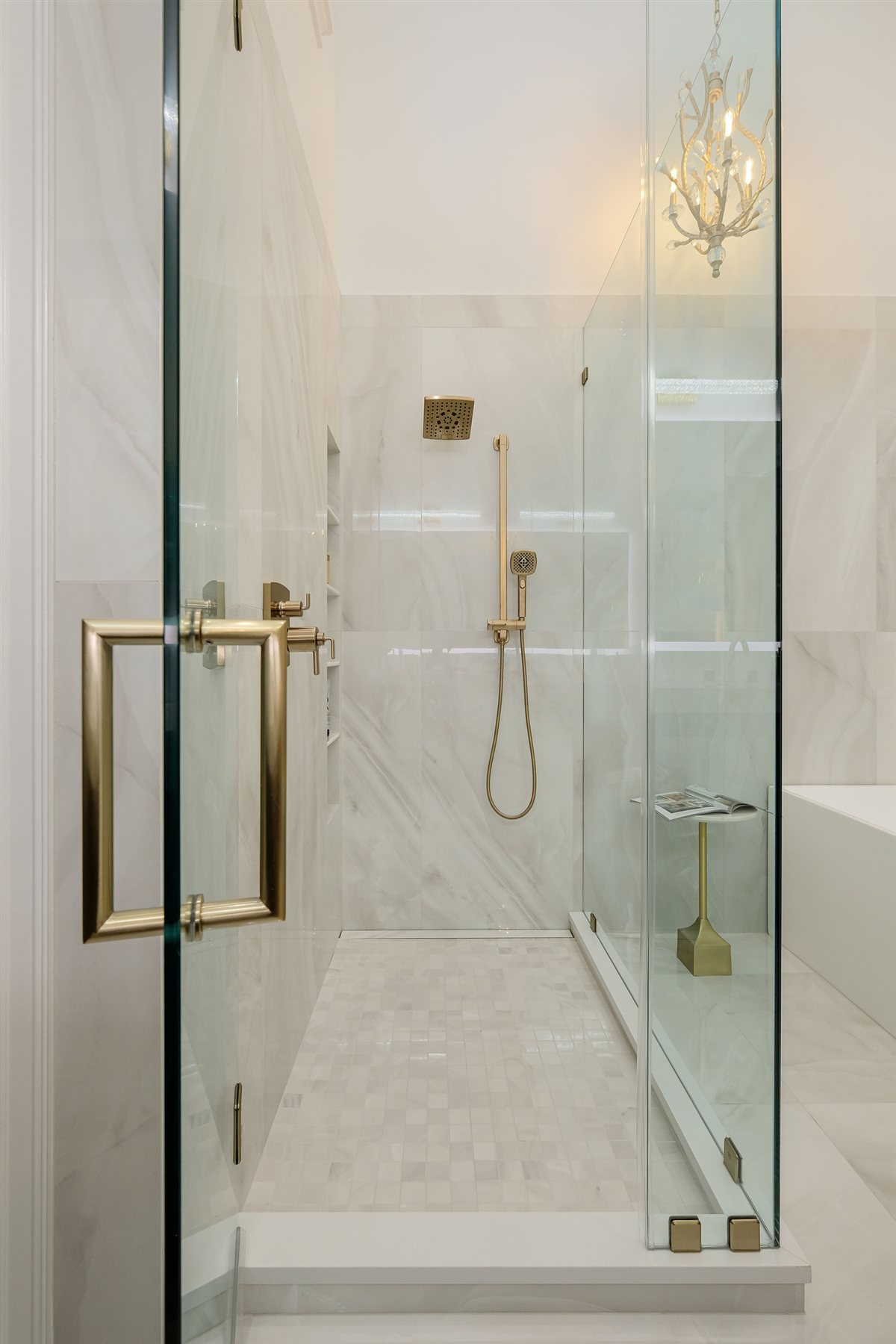 Glass shower enclosure with brass hardware, Uptown primary suite