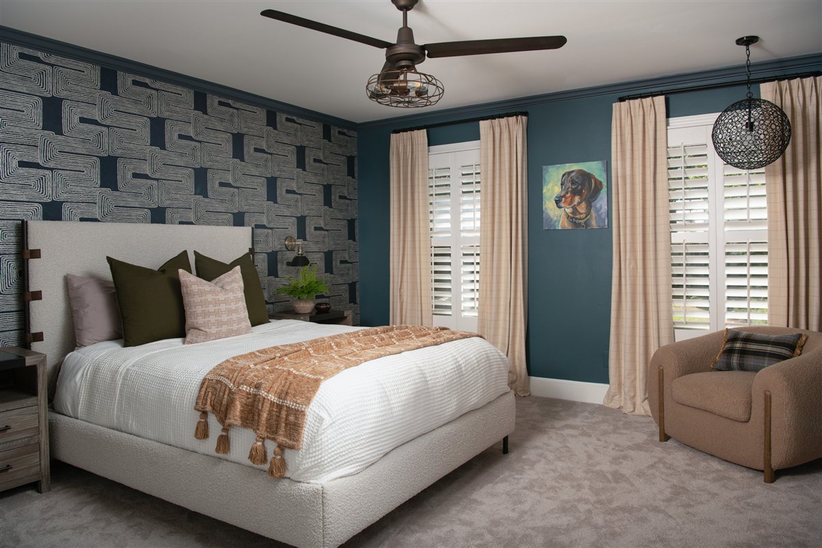 Bedroom with graphic wallpaper, ceiling fan and navy accent wall, Valencia Terrace renovation