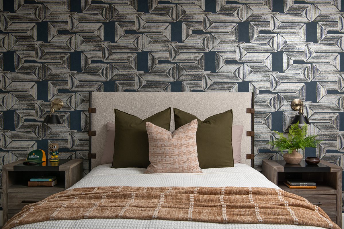 Upholstered bed against bold patterned wallpaper, Valencia Terrace renovation
