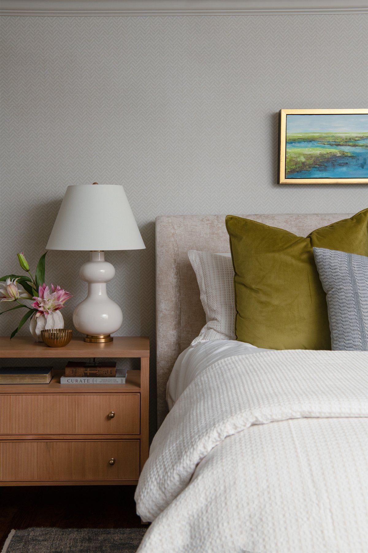 Bed with white linens and green pillows, Valencia Terrace addition