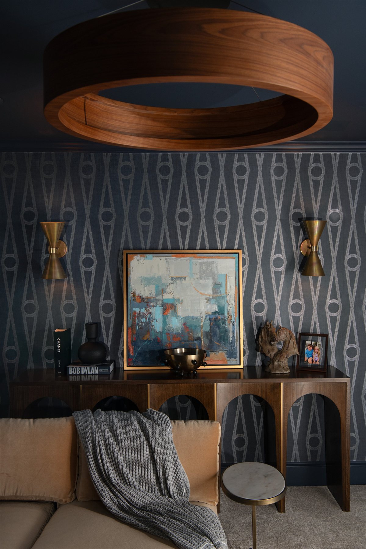 Den console with a wood ring pendant and patterned wallpaper, Valencia Terrace renovation