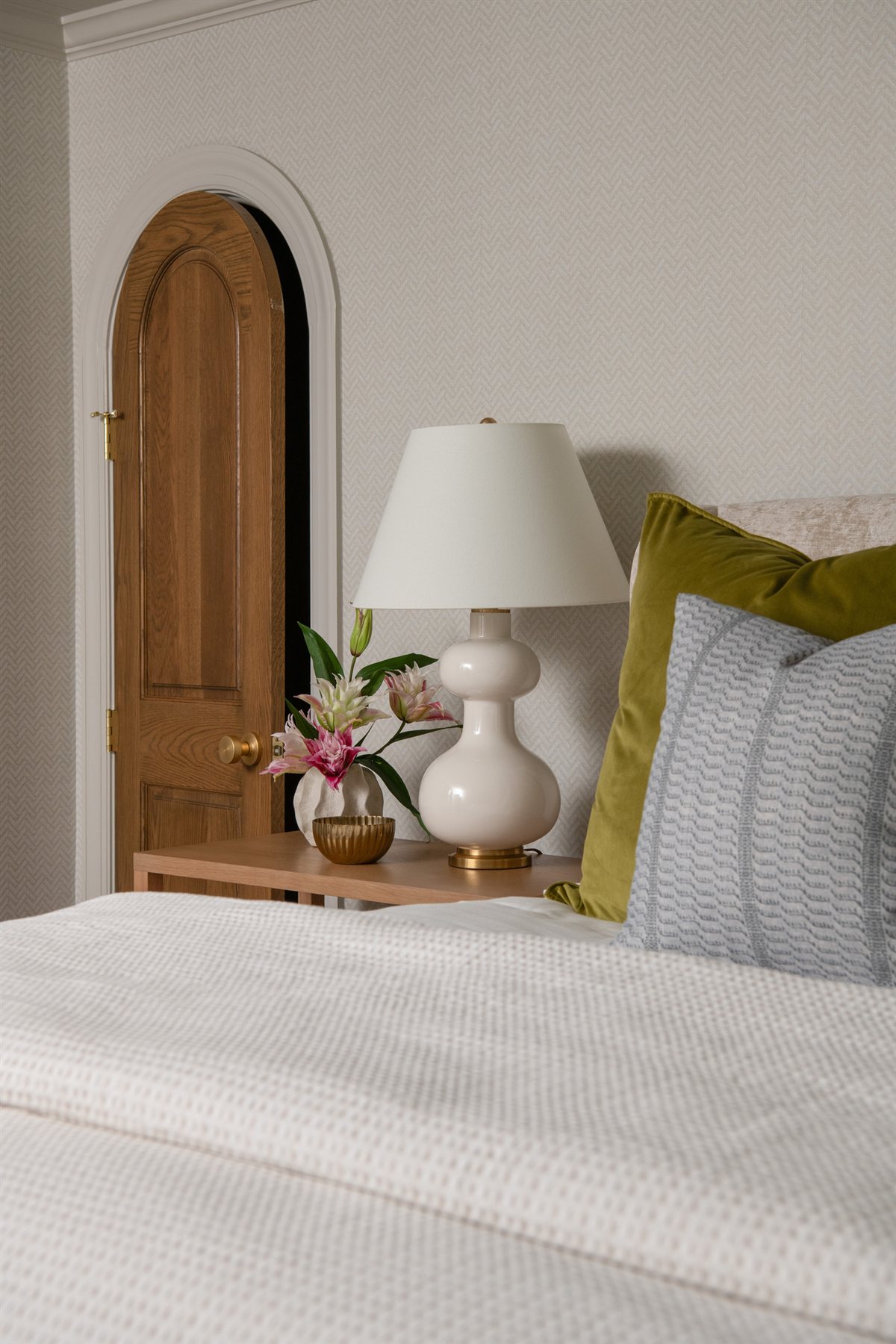 Arched wood door beside the bed, Valencia Terrace addition