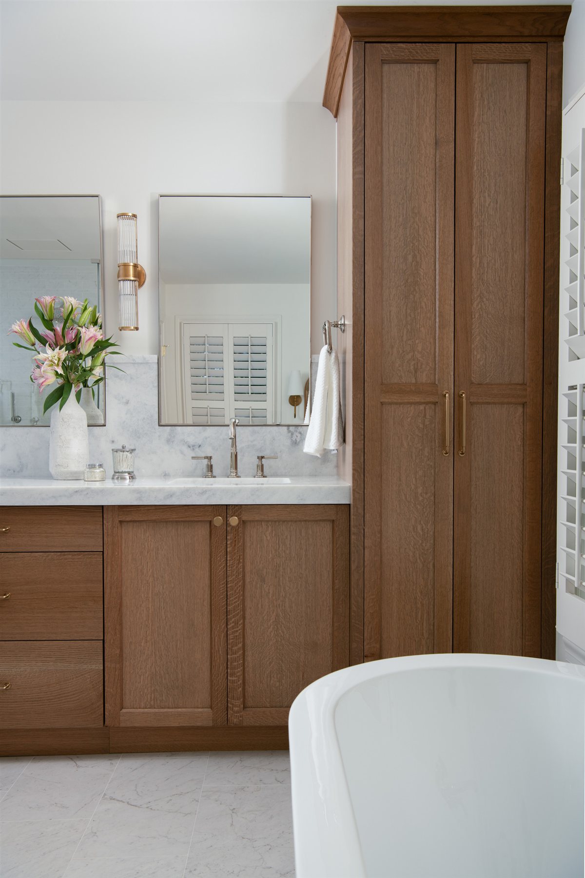 Wood vanity beside a freestanding tub, Valencia Terrace addition