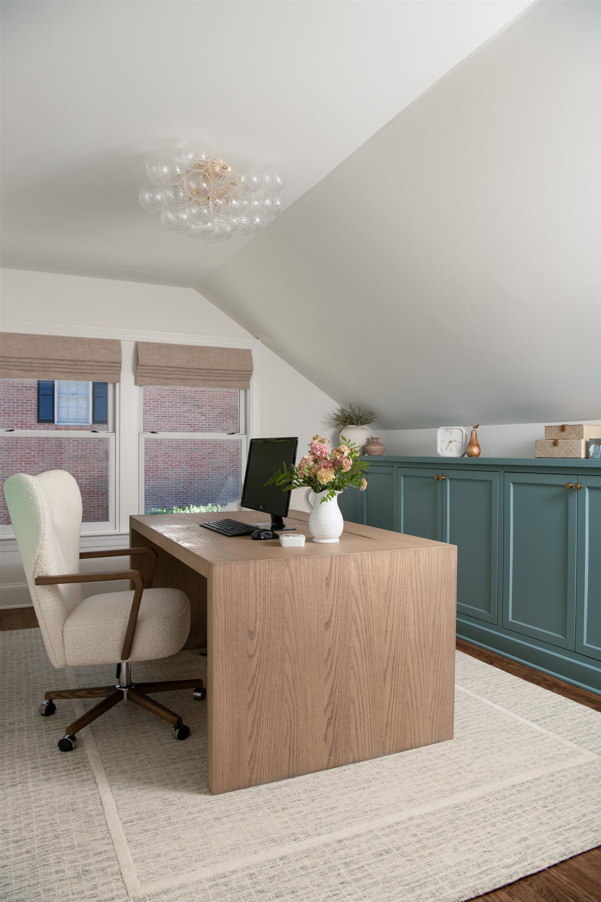 Home office with a wood desk under a sloped ceiling, Valencia Terrace addition