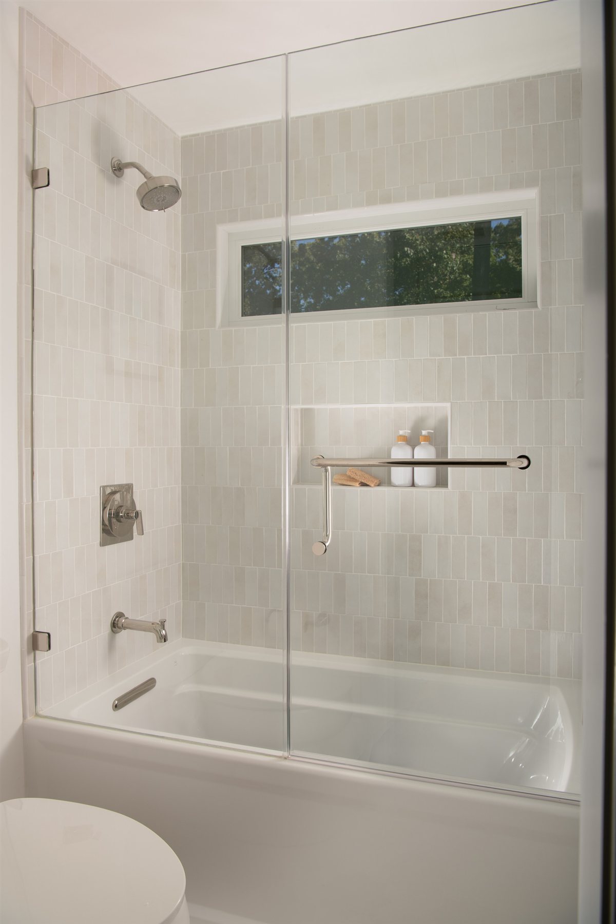 Tub and shower with a glass door, Valencia Terrace renovation
