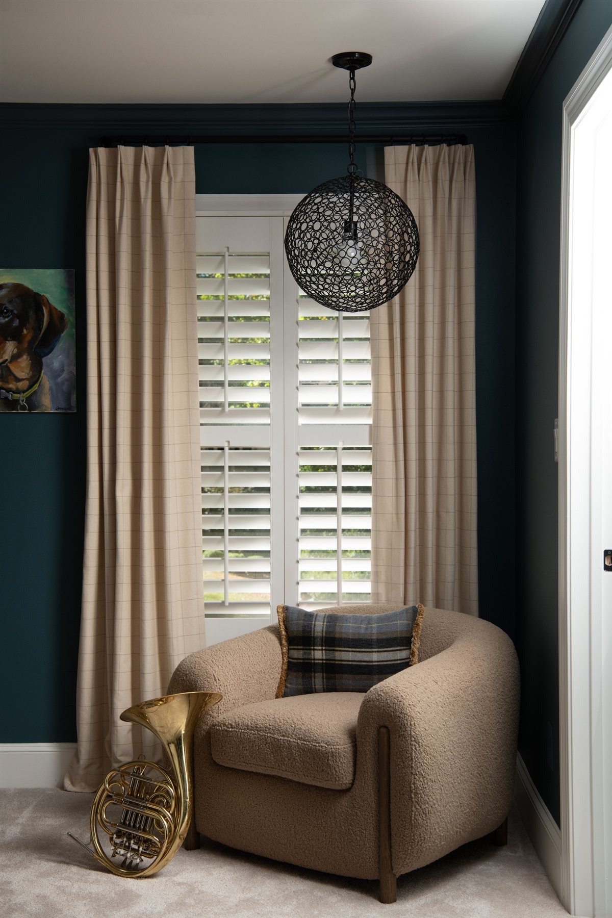Bedroom corner with a swivel chair and plantation shutters, Valencia Terrace renovation